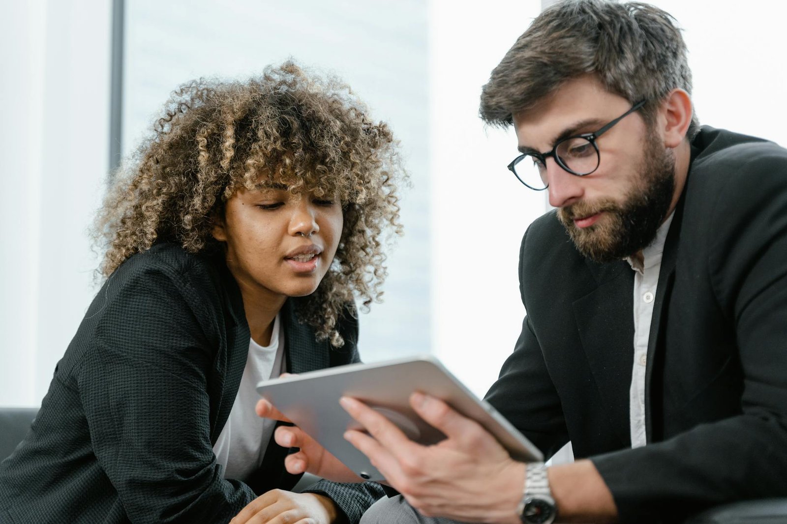 image Man in Black Suit Jacket Holding Black Tablet Computer
