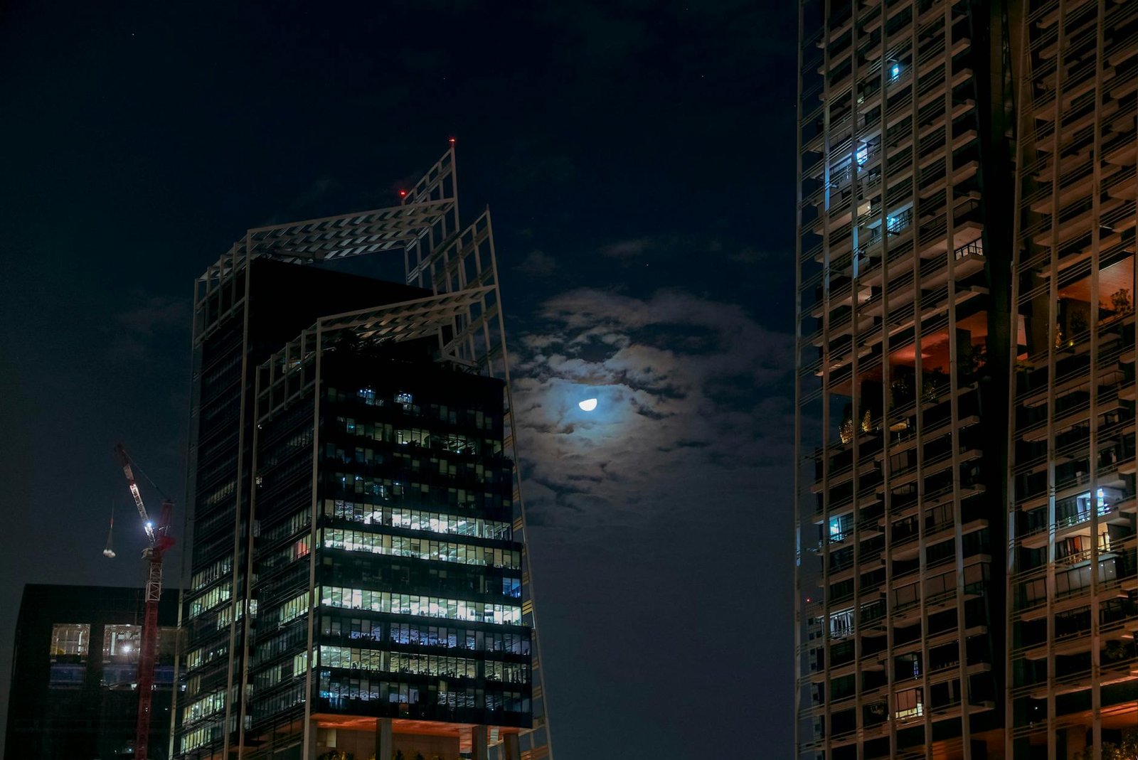 image Moon in Night Sky near City Skyscrapers