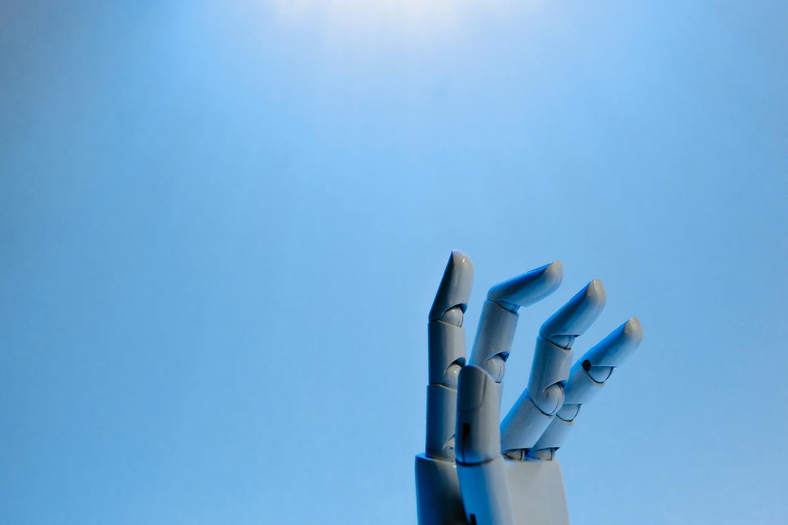 image Robot Fingers on Blue Background
