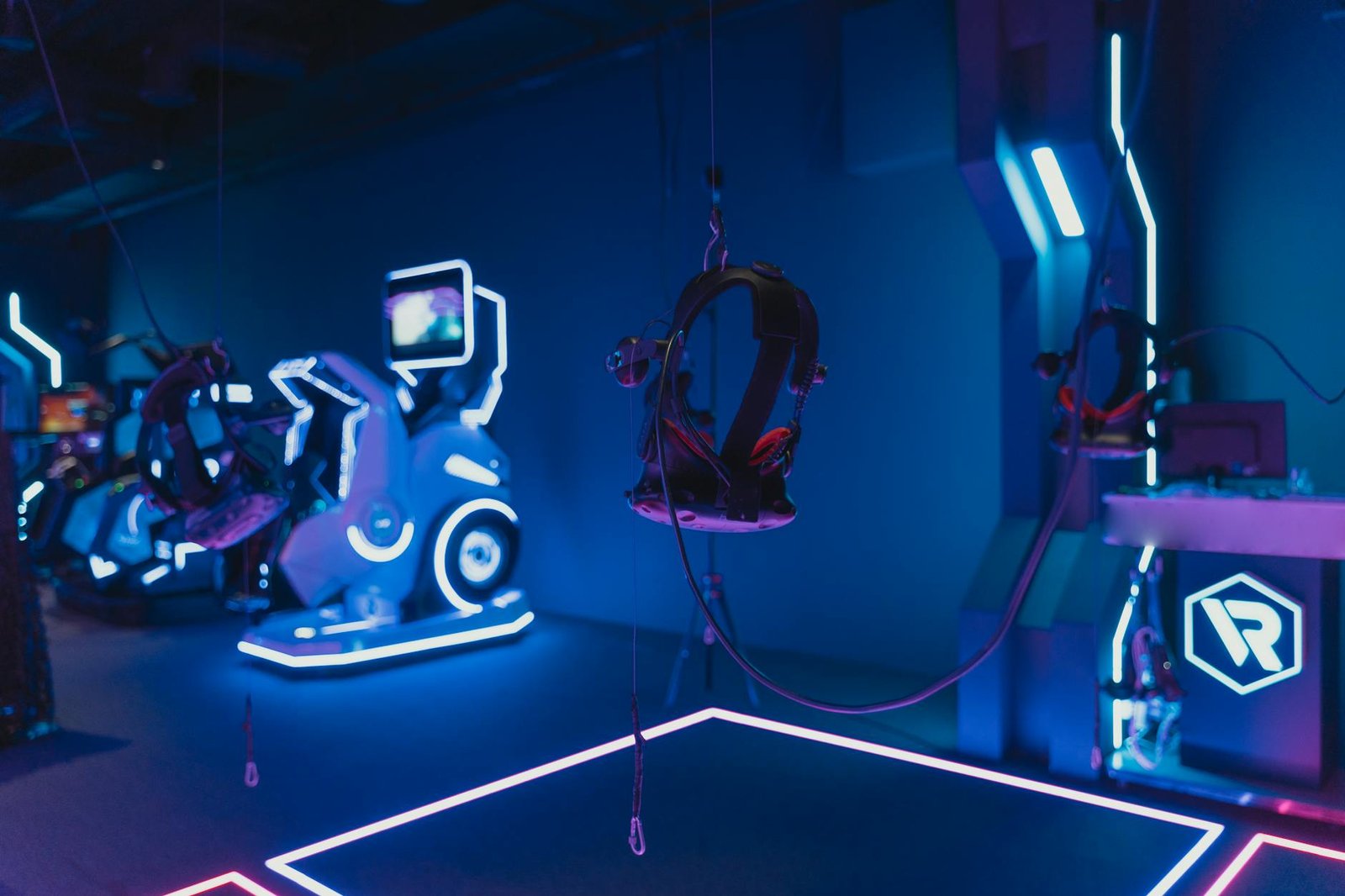 Immersive VR gaming setup with neon lights showcasing advanced technology.