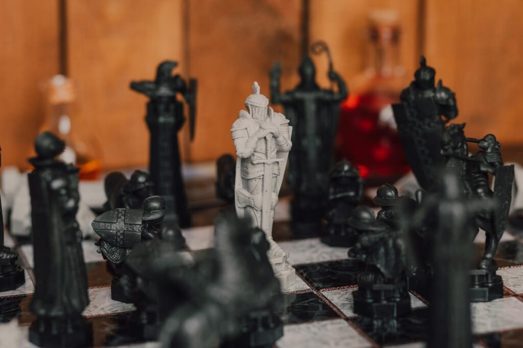 Close-up of medieval-themed chess pieces on a board, creating a strategic atmosphere.